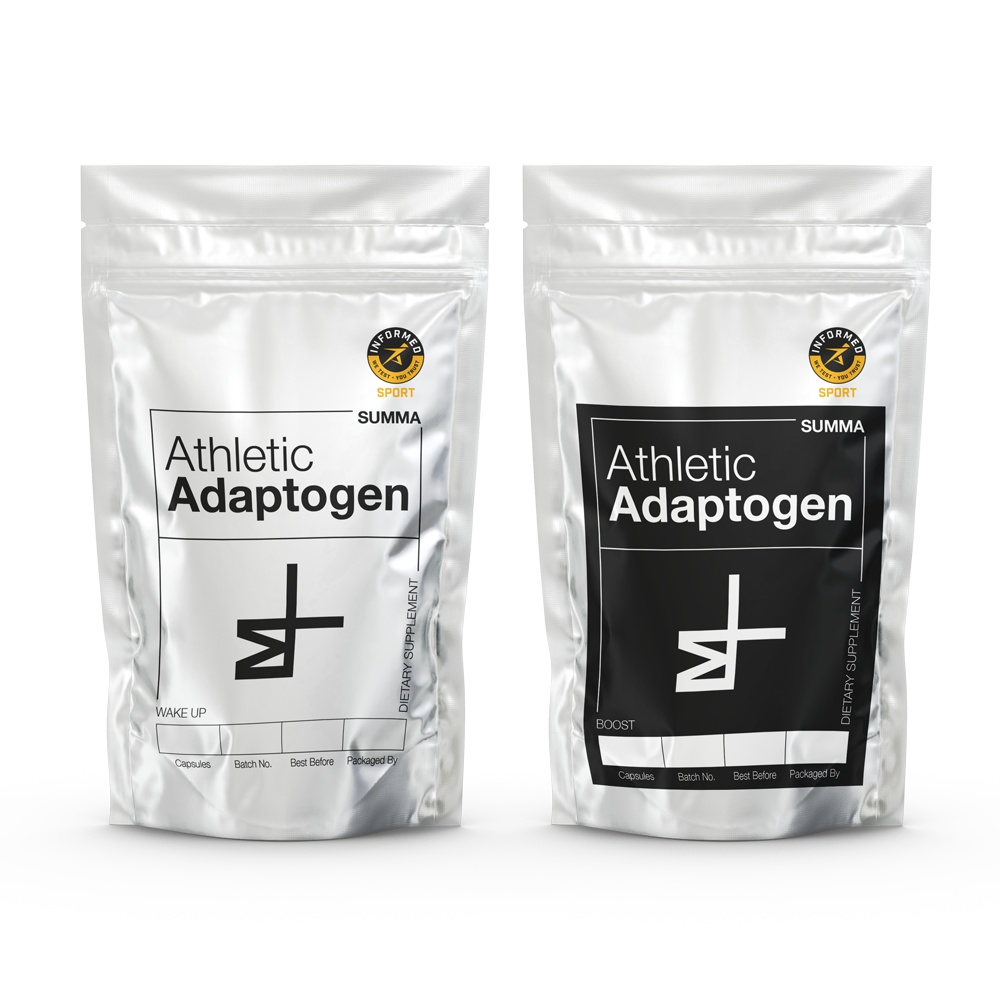 Front view of two silver pouches featuring the 'Athletic Adaptogen' product label and the Summa Labs logo. One pouch is labeled 'Wake Up' and the other 'Boost,' with handwritten batch numbers. The packaging exudes a modern and sleek aesthetic, with the 'Informed Sport Certified' logo prominently displayed for added assurance