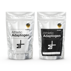 Front view of two silver pouches featuring the 'Athletic Adaptogen' product label and the Summa Labs logo. One pouch is labeled 'Wake Up' and the other 'Boost,' with handwritten batch numbers. The packaging exudes a modern and sleek aesthetic, with the 'Informed Sport Certified' logo prominently displayed for added assurance