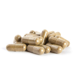 A picture of clear capsules containing brown powder like substance with a white backround.